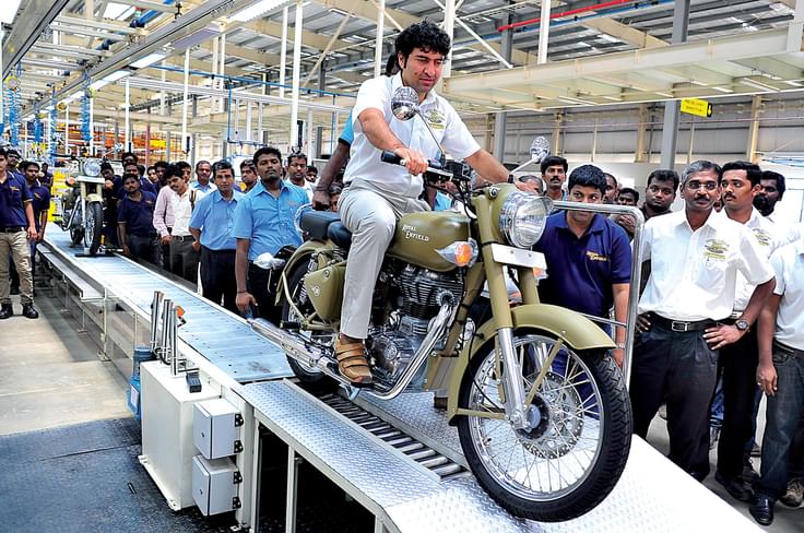 Siddhartha Lal rolls the first production motorcycle off the assembly line. Siddhartha Lal rolls the first production motorcycle off the assembly line.